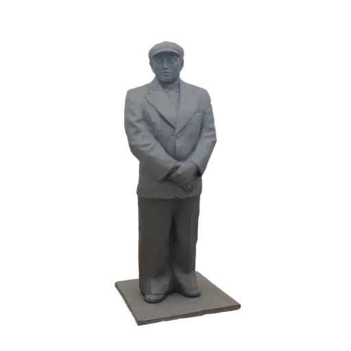 3D model of a man in a gray suit and flat cap, standing with hands clasped, on a square base.