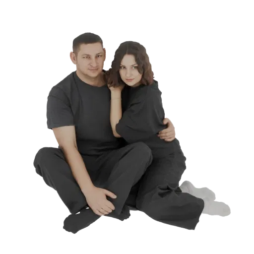 Modèle 3D d'un homme et d'une femme assis l'un près de l'autre, la femme reposant sa tête sur l'épaule de l'homme.