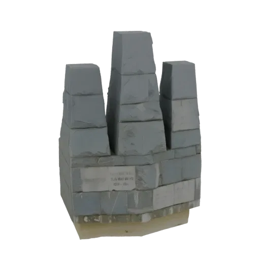 3D model of a grey stone monument with stacked blocks and an inscribed plaque on a black background.