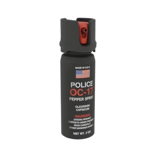 3D model of a black Police OC-17 pepper spray can with a red nozzle and protective cap, showing detailed warning labels.