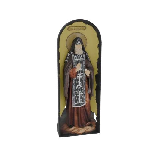 3D model of an Orthodox monk in traditional robes, depicted in an icon-style statue with a halo and intricate vestments.