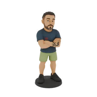 3D model of a muscular man with crossed arms, wearing a blue t-shirt and green shorts, with a tribal tattoo on his arm.