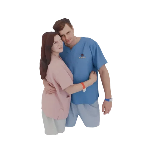 3D model of a man in a blue scrub top and a woman in a pink scrub top embracing affectionately, both wearing wristbands.