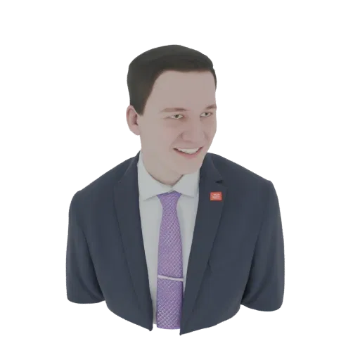 3D model of a man in a dark suit, white shirt, and purple tie, smiling.