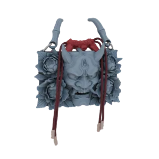 3D model of a grey Oni mask with red cords and peony flowers, designed as a bag charm.