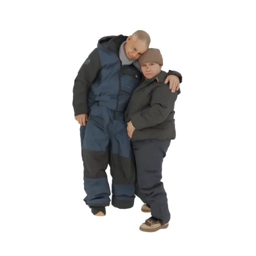 3D model of a couple embracing, both wearing winter coats and hats, with the man resting his head on the woman's shoulder.