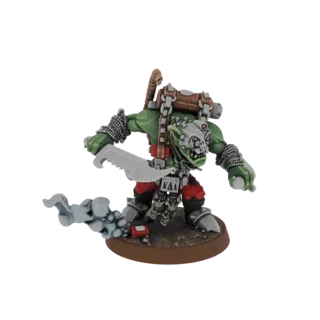 3D model of a green-skinned Orc Warrior in a charging pose, wielding a large serrated sword and leaving a smoke trail.