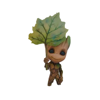 3D model of Baby Groot, a small tree-like creature, holding a large green leaf over his head as an umbrella.