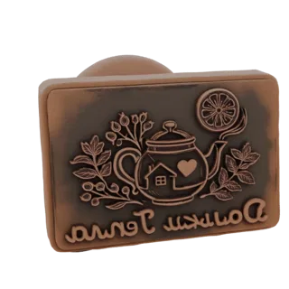 3D render of an antique-style embossed stamp featuring a teapot with a heart and house, surrounded by leaves and berries, wit
