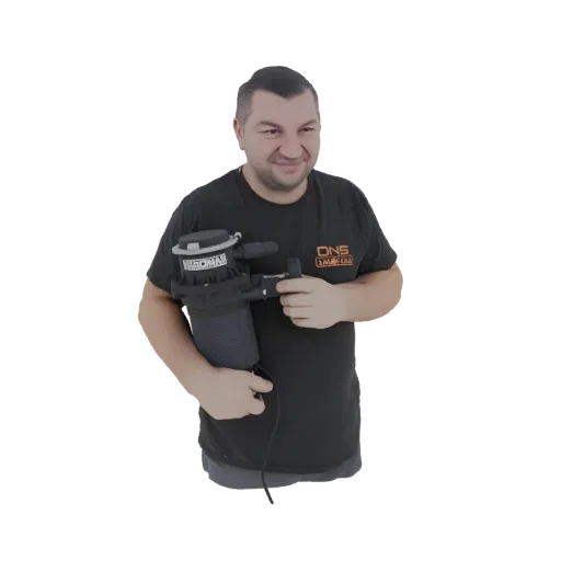 3D model of a smiling man in a black t-shirt holding a black air filter assembly with visible connectors and branding.
