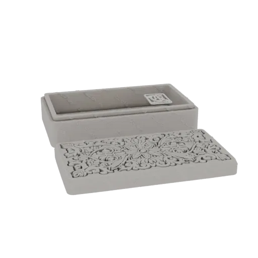 3D model of a rectangular box with a separate lid, both featuring intricate carved ornamental patterns.