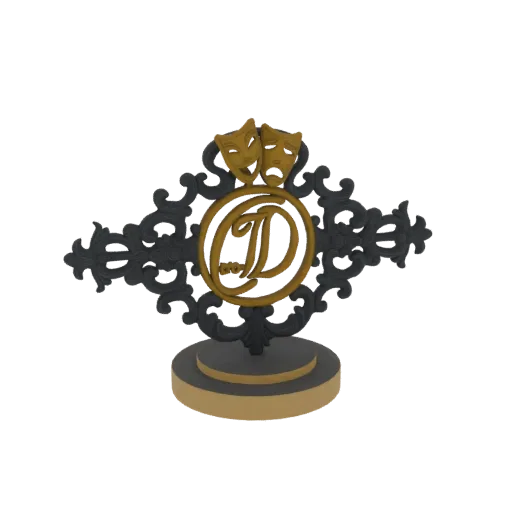 3D model of a theatrical emblem with gold comedy and tragedy masks, a central 'D' monogram, and black scrollwork on a tiered