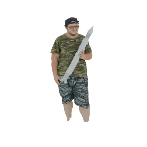 3D model of a man wearing a camouflage t-shirt and shorts, holding a large, grey rocket prop.