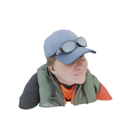 3D model of a woman wearing a green life vest, a blue cap, and sunglasses, looking to the side with a slight smile.