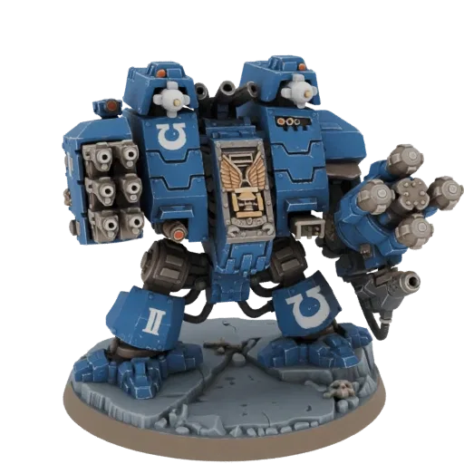3D model of a blue Space Marine Dreadnought with twin Lascannon and missile pods, standing on a rocky base.