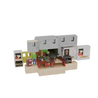 3D model of a miniature shop diorama with two figures, a red table, and a textured building facade on a sandy base.