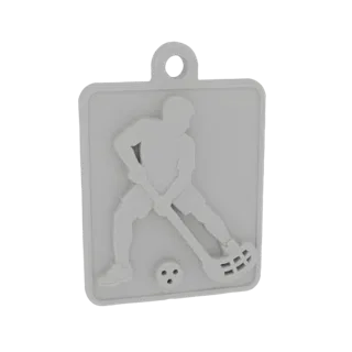 Modelo 3D de um jogador de floorball em ação, segurando um taco e perto de uma bola de floorball, apresentado como um pingent