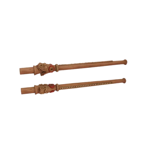 Two wooden flutes with intricate tribal carvings and red accents, presented on a black background.