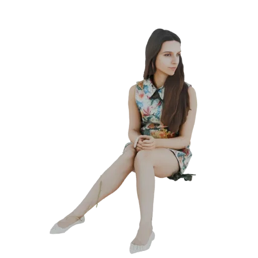 3D model of a young woman with long brown hair, wearing a floral dress, sitting with her hands in her lap.