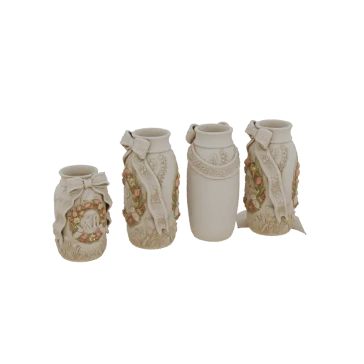 A set of four cream-colored decorative vases with intricate floral ribbon designs, displayed together.