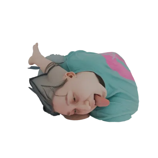 3D model of a child lying down, sticking out their tongue with a playful expression, wearing a teal t-shirt.