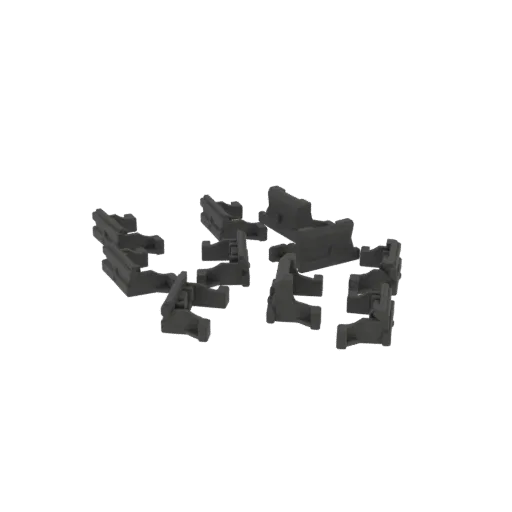 A scattering of gray industrial connectors, viewed from a slightly elevated angle against a black background.