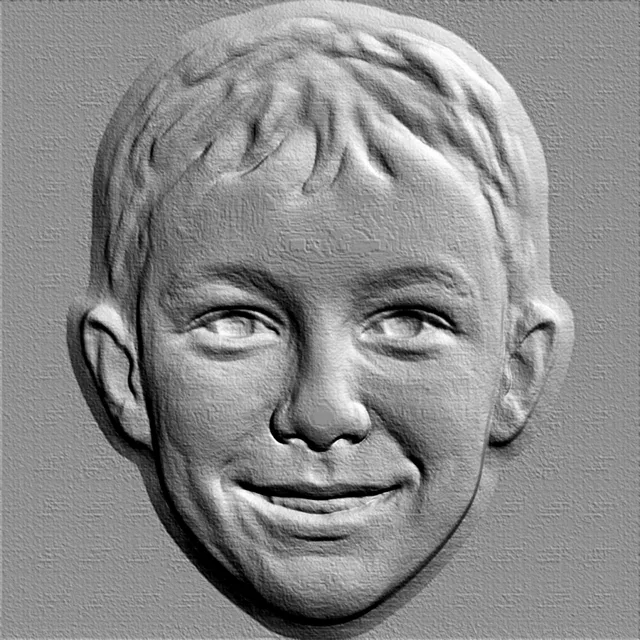 3D model of boy's face bas-relief with smile, front view