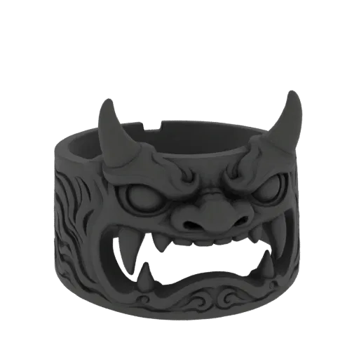 3D model of a dark gray ring featuring a detailed Oni mask with sharp fangs and horns, set against a black background.