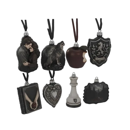 A collection of eight Twilight Saga themed Christmas ornaments, including a couple embracing, a wolf, a bitten apple, a crest