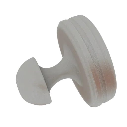A 3D render of a light gray, grooved circular stamp with a curved handle, isolated on a white background.