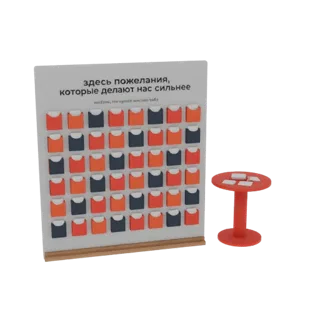 Modelo 3D de un tablero de deseos blanco con compartimentos naranjas y azules, una mesa roja y tarjetas, con texto en ruso.
