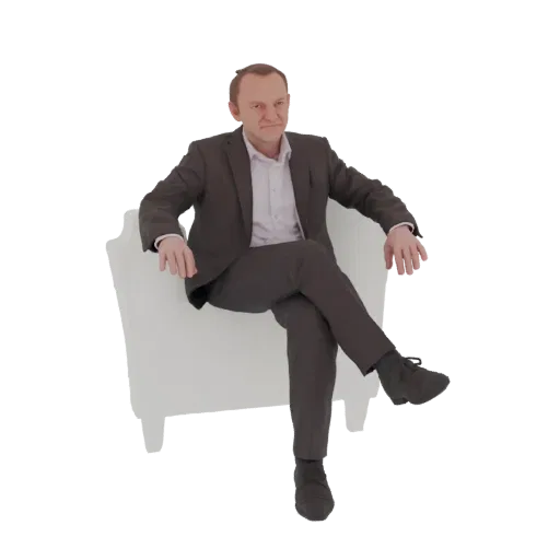 3D model of a businessman in a dark suit sitting with legs crossed in a white armchair, looking towards the viewer.