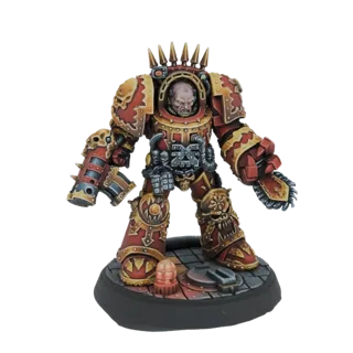 3D model of a Chaos Space Marine in red and gold armor, wielding a chainaxe and bolter, standing on a diorama base.