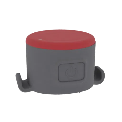 Render 3D di un dispositivo cilindrico compatto grigio con top rosso e icona pulsante, dotato di ganci laterali.