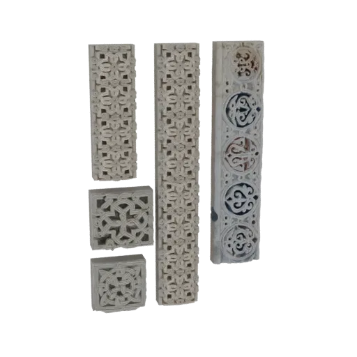 A 3D render of four ornate carved panels with intricate geometric patterns, displayed against a black background.