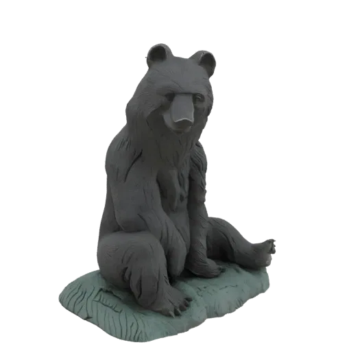 3D model of a grey, matte-finished statue of a bear sitting on a textured green base, with detailed fur and a natural pose.