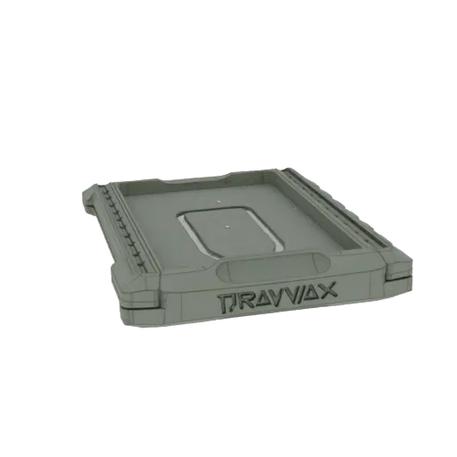 3D render of a grey Travvax tray with embossed branding and textured edges, isolated on a black background.
