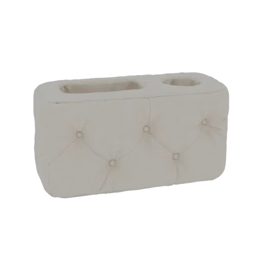 3D model of a rectangular tissue box holder with button-tufted upholstery in a neutral beige fabric, featuring two openings o