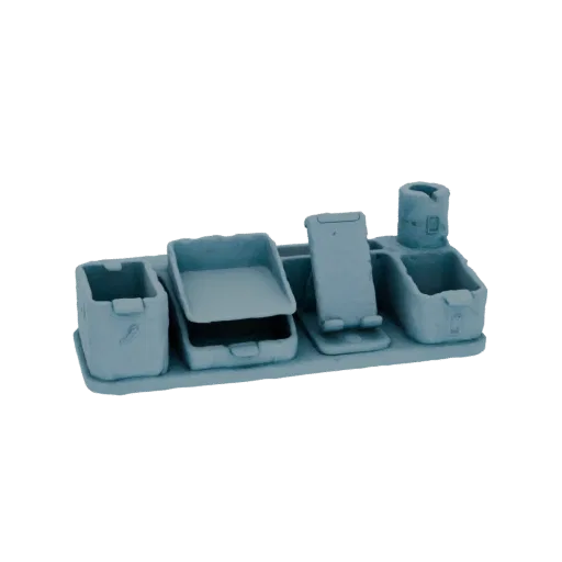 A light blue, 3D rendered modern desk organizer with compartments for pens, a phone stand, and storage trays, set against a b