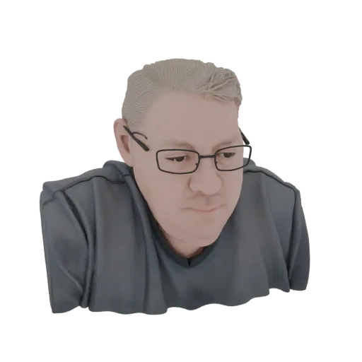 3D model render of a bust of a man with short blonde hair and black-rimmed glasses, wearing a grey t-shirt.