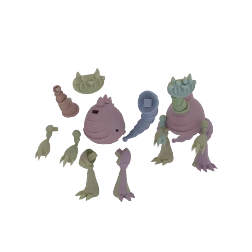 A collection of colorful, clay-like monster parts including a body, limbs, horns, and a tail, arranged for assembly.