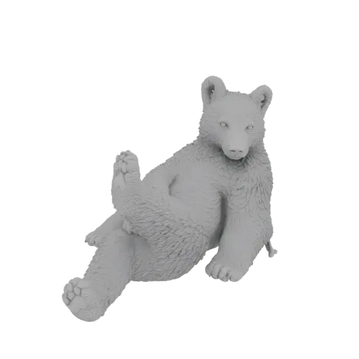A 3D model of a cute bear cub sitting playfully with one leg crossed, rendered in a light gray material.