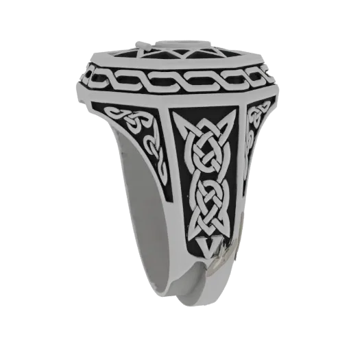 3D model of a ring with intricate Celtic knot designs on the band, rendered with a polished metallic finish.