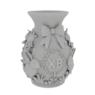 Modelo 3D de jarrón de Pascua con relieve, que representa conejitos, un lazo, flores y una corona con las letras «ХВ».