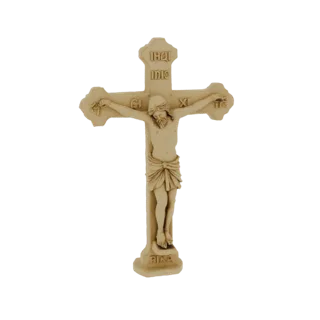 Relief Orthodox cross with Christ figure, in gold color, on a white background