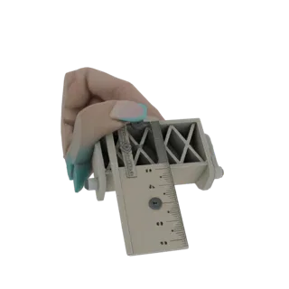 A 3D render of a realistic human hand holding a beige caliper measuring tool with a visible ruler and scale.