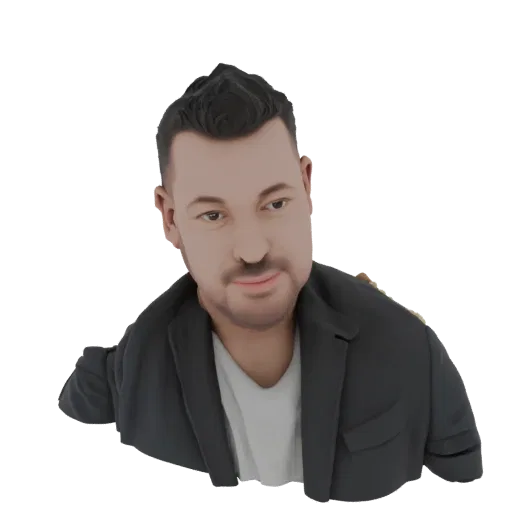 3D model render of a stylized man's bust wearing a black blazer and white t-shirt, with dark hair and a slight smile.